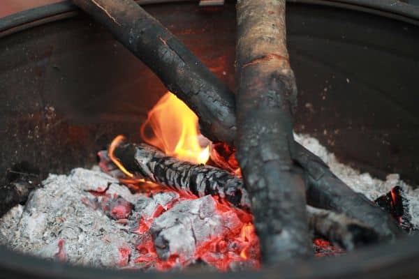 wood chips burning in fire pit.