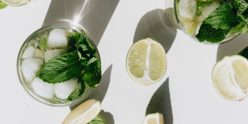 Close-Up Photo Of Mint Leaves On Glass
